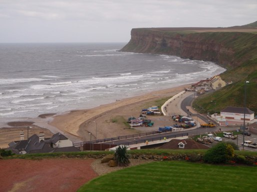 Discharge point on Saltburn beach (under bridge), with Cleveland Ironstone Formation exposed in cliffs.
